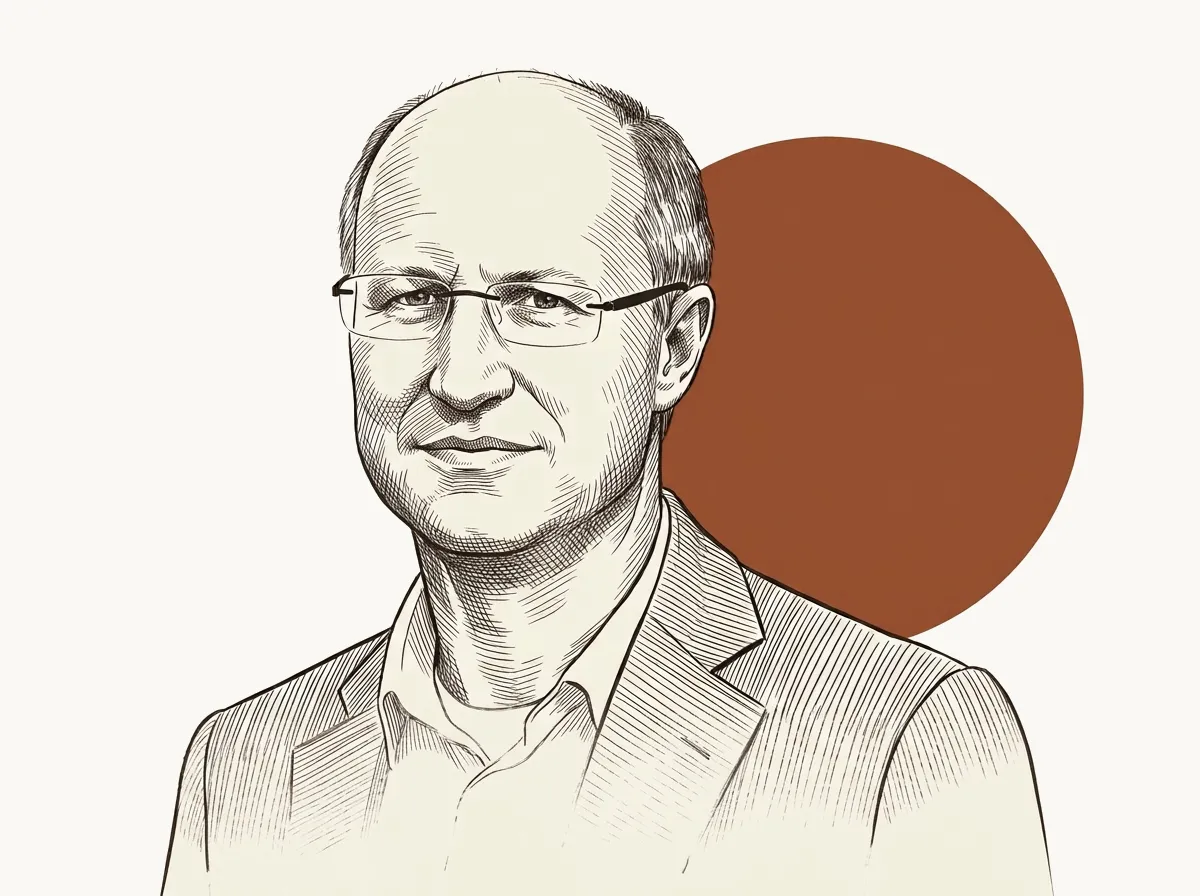 Portrait dessiné de Jean-Michel De Waele, lunettes fines, devant un disque rouille